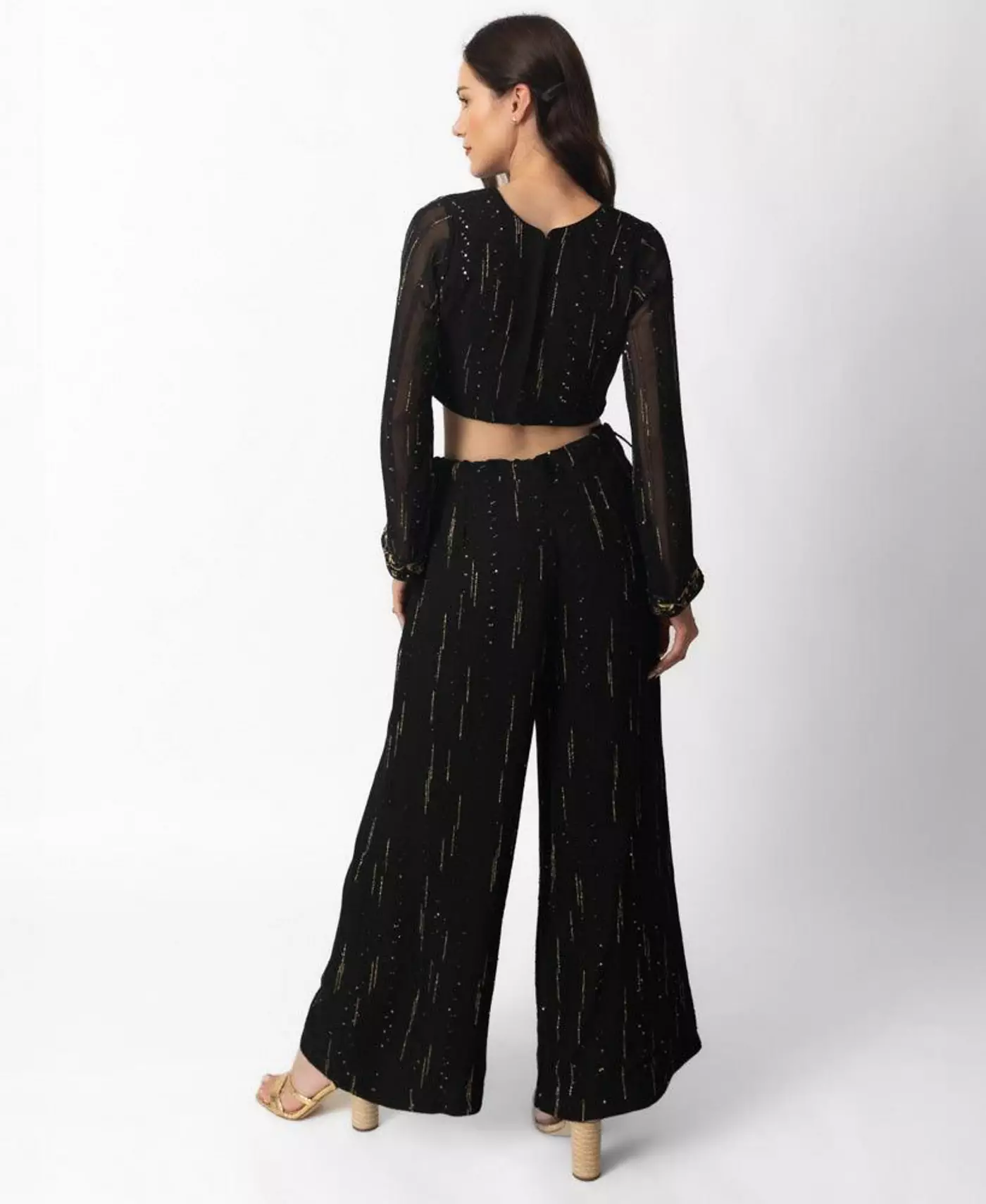 Женский черно-золотой брючный костюм палаццо с укороченным топом с длинными рукавами от RAAS