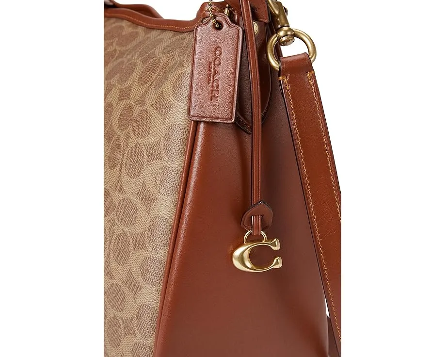 Сумка через плечо COACH Signature Cary из покрытого холста и телячьей кожи