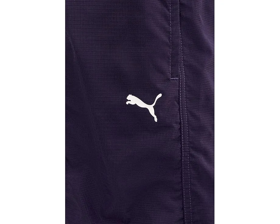 Брюки Dare To Woven от PUMA из водоотталкивающего рипстопа с резинками по низу