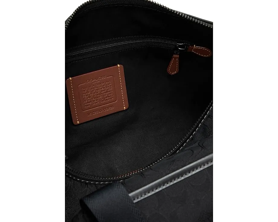 Дорожная сумка COACH Theo из фирменного жаккарда с кожаными деталями