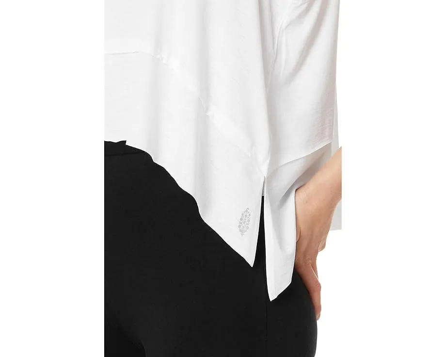 Топ Tempo Tank от FP Movement с дышащей тканью и высоко-низким подолом