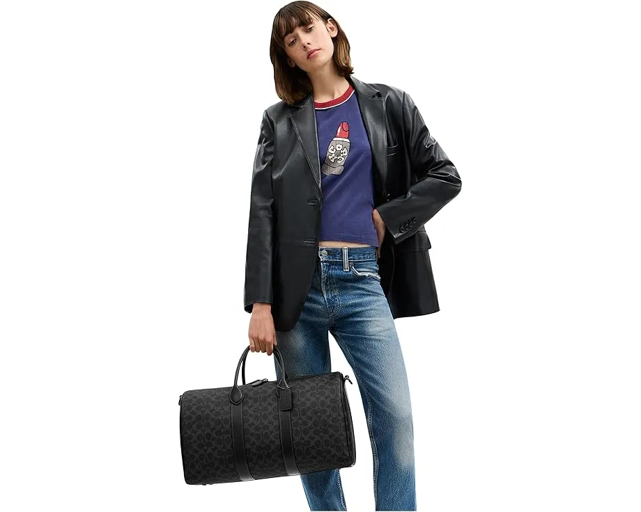 Сумка COACH Compass Bag 45 из фирменного холста с кожаными деталями и съемным ремнем