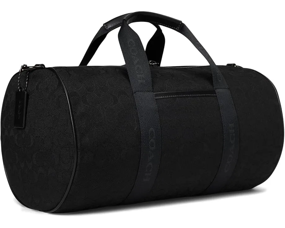 Дорожная сумка COACH Theo из фирменного жаккарда с кожаными деталями