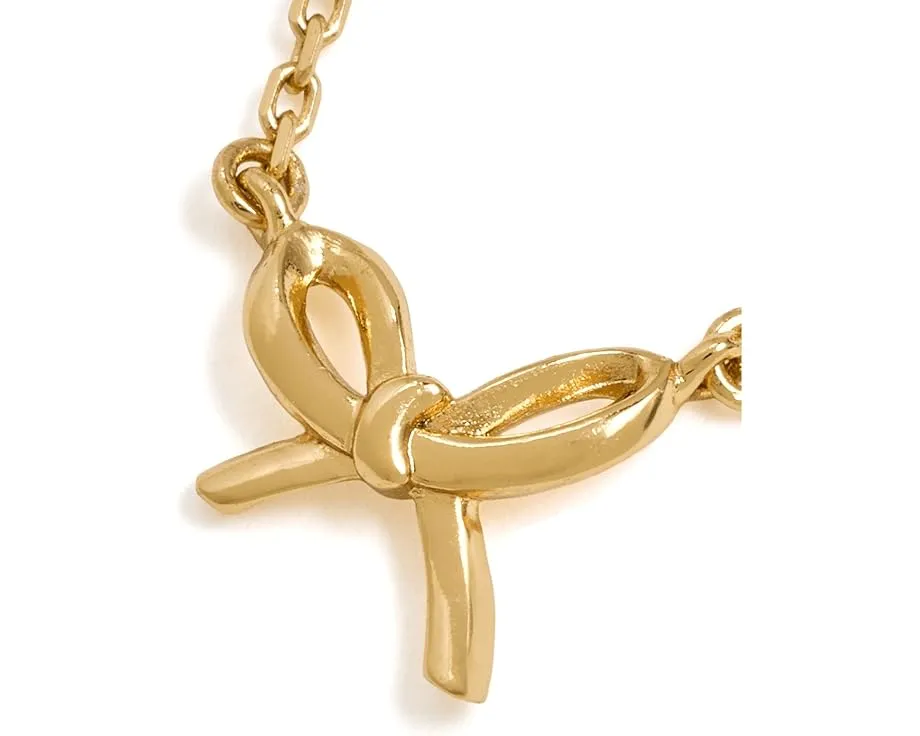 Мини-подвеска Girlie Pearlie Mini Bow Pendant от Kate Spade New York с бантиком