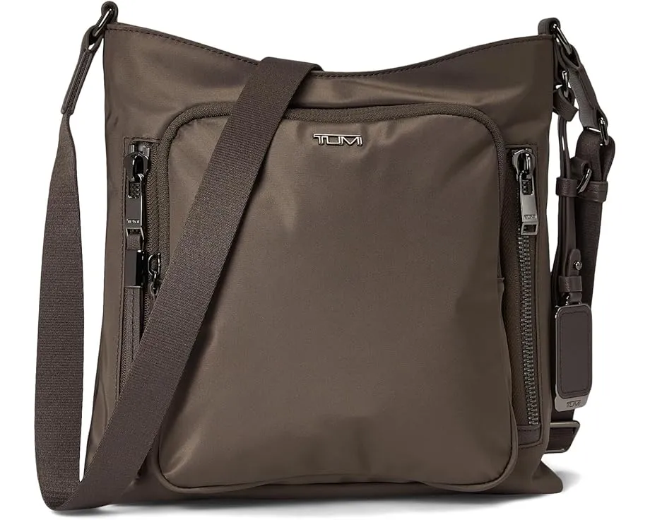 Кроссбоди Tumi Tyler с множеством карманов и съемным кожаным шармом