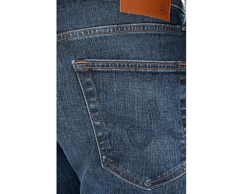 Джинсы AG Tellis Modern Slim с зауженным низом и средней посадкой