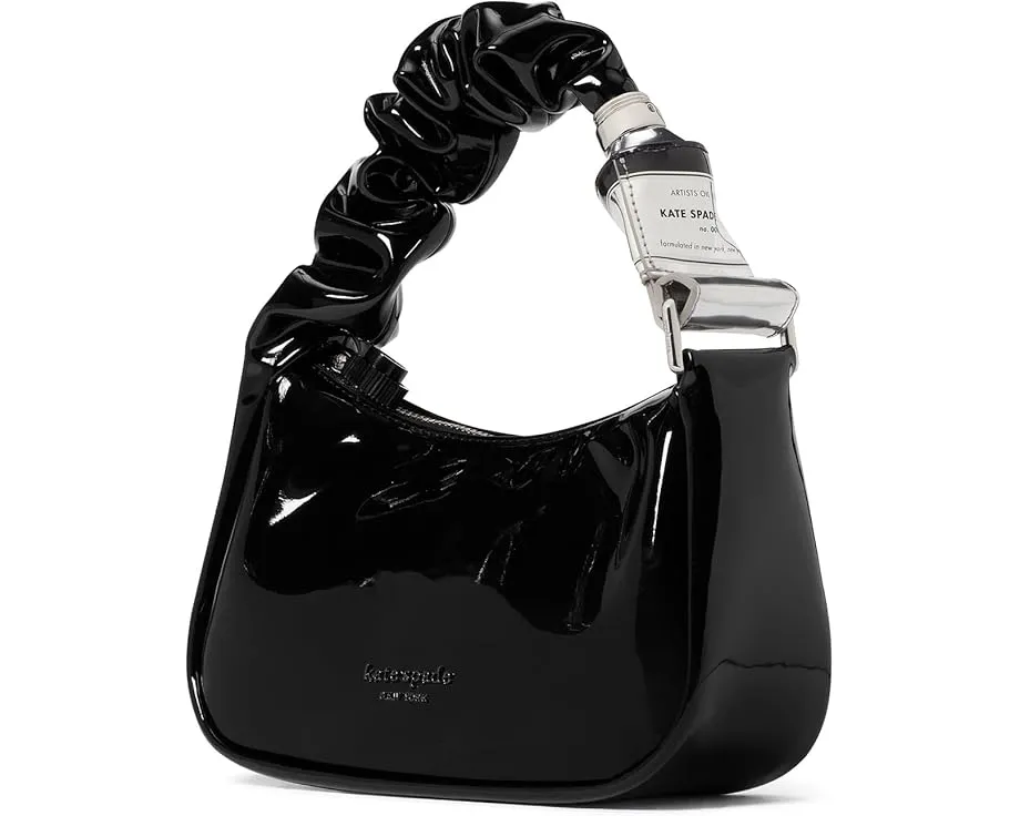 Сумка Kate Spade New York Squeeze из лакированного полиуретана с уникальным ремнем