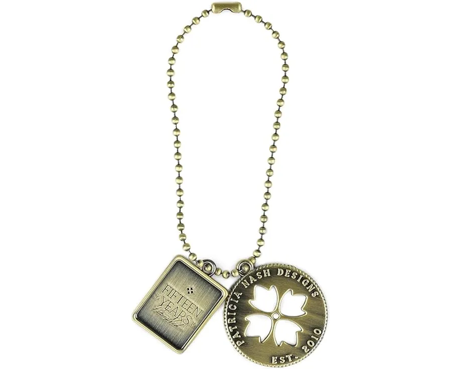 Patricia Nash сумка Napoli Satchel с юбилейной медальоном