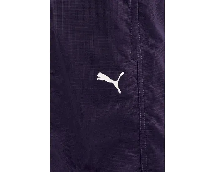 Брюки Dare To Woven от PUMA из водоотталкивающего рипстопа с резинками по низу
