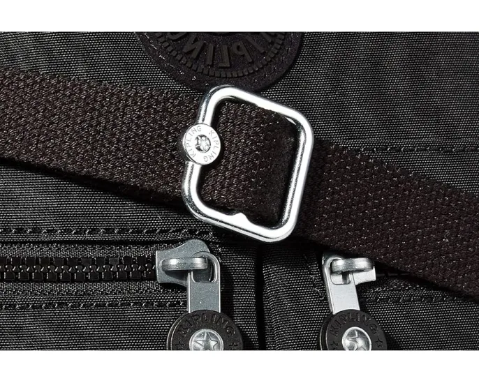 Сумка кроссбоди New Angie от Kipling с регулируемым ремнем и плоским дном
