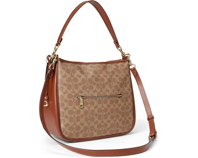 Сумка через плечо COACH Signature Cary из покрытого холста и телячьей кожи