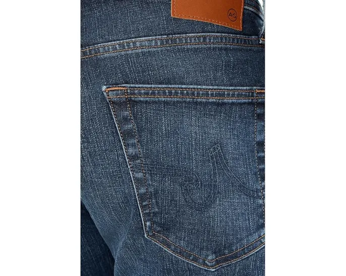 Джинсы AG Tellis Modern Slim с зауженным низом и средней посадкой