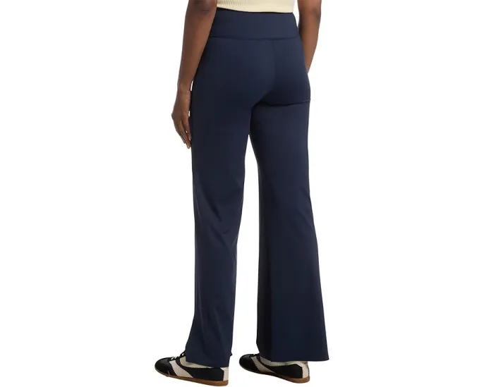 Брюки Moveknit Bonded Pants от TravisMathew с расклешенным низом и высокой талией