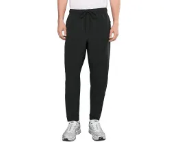 Брюки Nike Unlimited Dri FIT с зауженным кроем и карманами на молнии