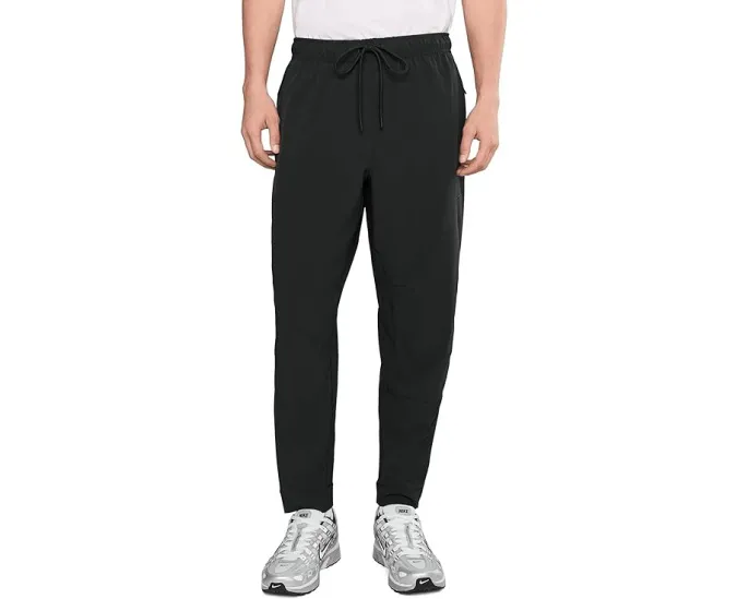 Брюки Nike Unlimited Dri FIT с зауженным кроем и карманами на молнии