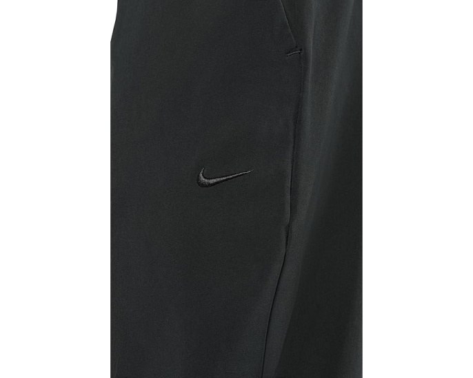 Брюки Nike Unlimited Dri FIT с зауженным кроем и карманами на молнии