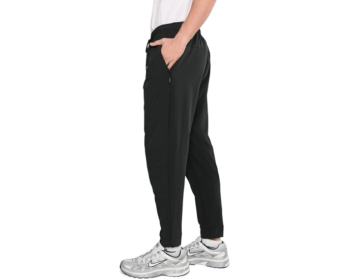 Брюки Nike Unlimited Dri FIT с зауженным кроем и карманами на молнии