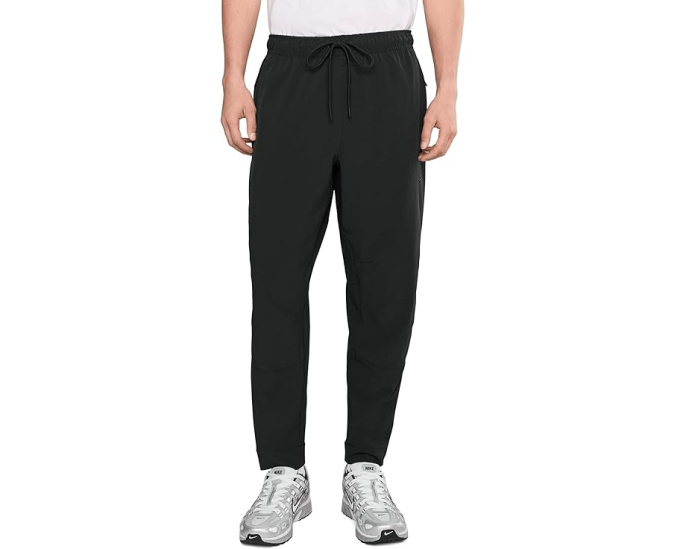 Брюки Nike Unlimited Dri FIT с зауженным кроем и карманами на молнии